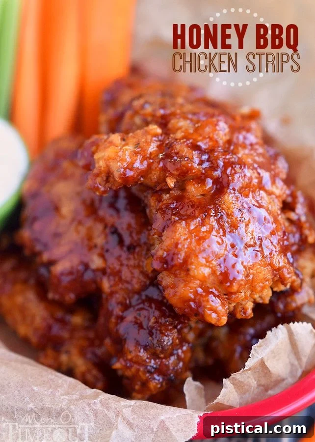 Golden-brown Honey BBQ Chicken Strips piled high in a rustic basket, ready to be devoured for dinner or a special event.