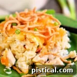 One serving of Hawaiian chicken casserole on a green plate, ready to be enjoyed.
