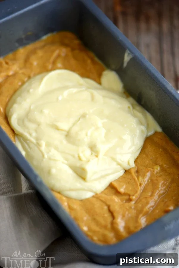 Preparing the delicious Pumpkin Cheesecake Banana Bread batter - a blend of warm spices, ripe bananas, and pumpkin puree. The vibrant orange batter for pumpkin banana bread being prepared in a mixing bowl, prior to the addition of the cheesecake swirl.