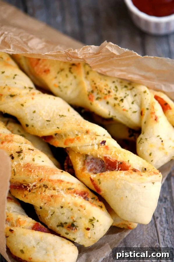 Perfect for game day celebrations or a fun, kid-friendly dinner, these Pepperoni Pizza Twists are guaranteed to become a new family favorite! Easy, cheesy, awesomeness!