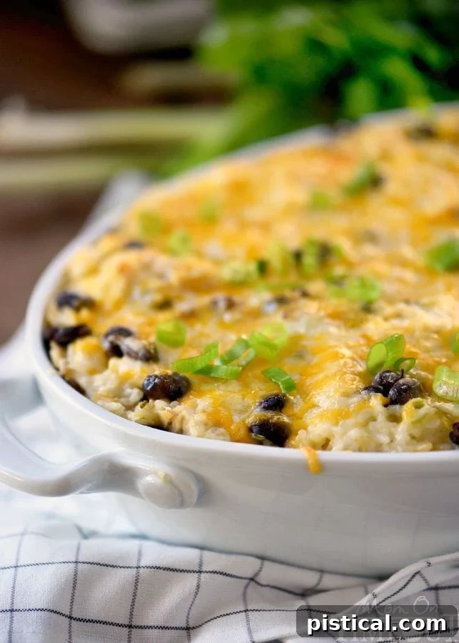 A close-up shot of the Mexican Chicken and Rice Casserole, showcasing the melted cheese and layers of flavorful ingredients, promising a comforting meal.