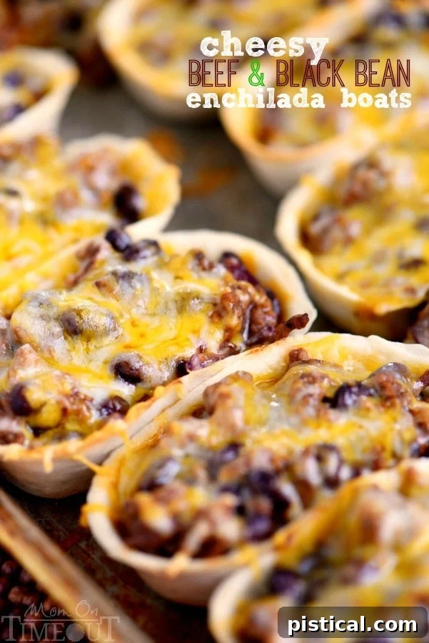 Delicious Cheesy Beef and Black Bean Enchilada Boats ready to be served, garnished with fresh cilantro and sour cream