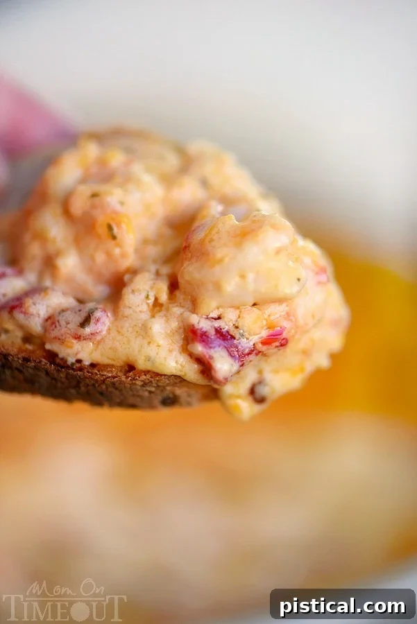 Fire-Roasted Red Pepper Shrimp Scampi Dip 3 Close-up of the bubbling hot Roasted Red Pepper Shrimp Scampi Dip, showing the rich texture and shrimp pieces.