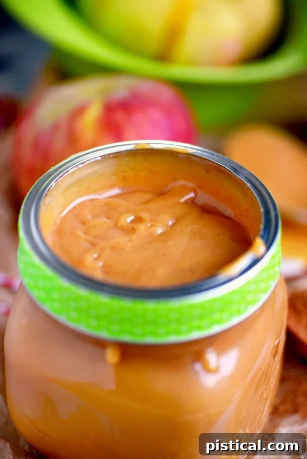 This easy Pumpkin Spice Caramel Apple Dip is sure to be the star at your next party! So easy to make and just bursting with fall flavor! Great for a fruit dip or as an ice cream topping! // Mom On Timeout #caramelappledip #caramelapple #pumpkinspice #pumpkin #thanksgiving #fall #holidays #appetizer #dip #recipe A rustic jar filled with homemade Pumpkin Spice Caramel Apple Dip, adorned with a cozy autumn-themed label, ready for serving.
