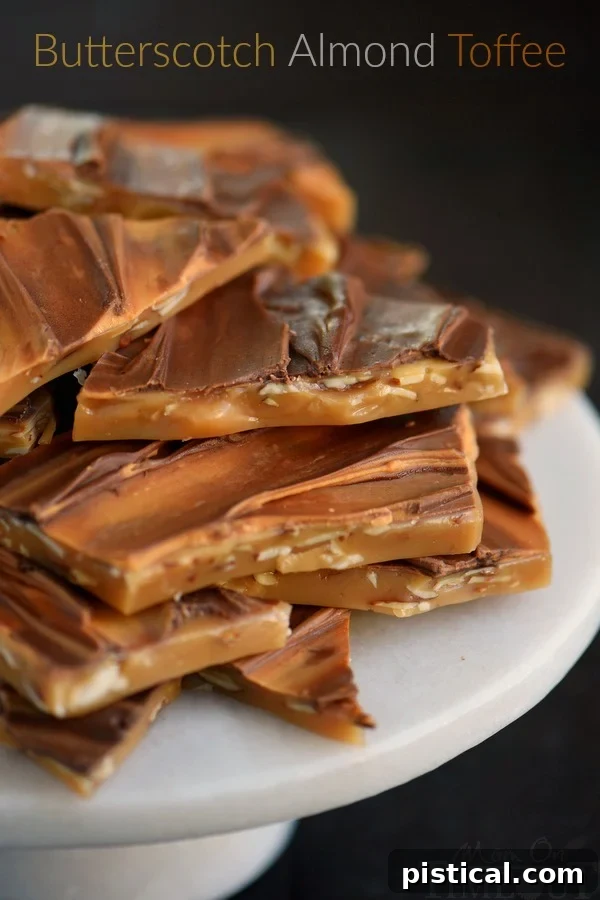 Close-up of golden Butterscotch Almond Toffee pieces, showcasing their rich color and crunchy texture