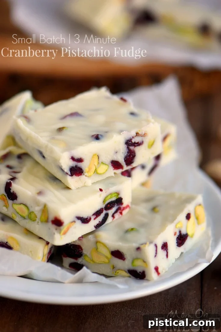 Cranberry Pistachio Fudge squares on a serving plate, highlighting the delicious texture and vibrant holiday colors of this easy, small batch recipe.