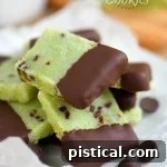 mint shortbread cookies dipped in chocolate and arranged on a white plate