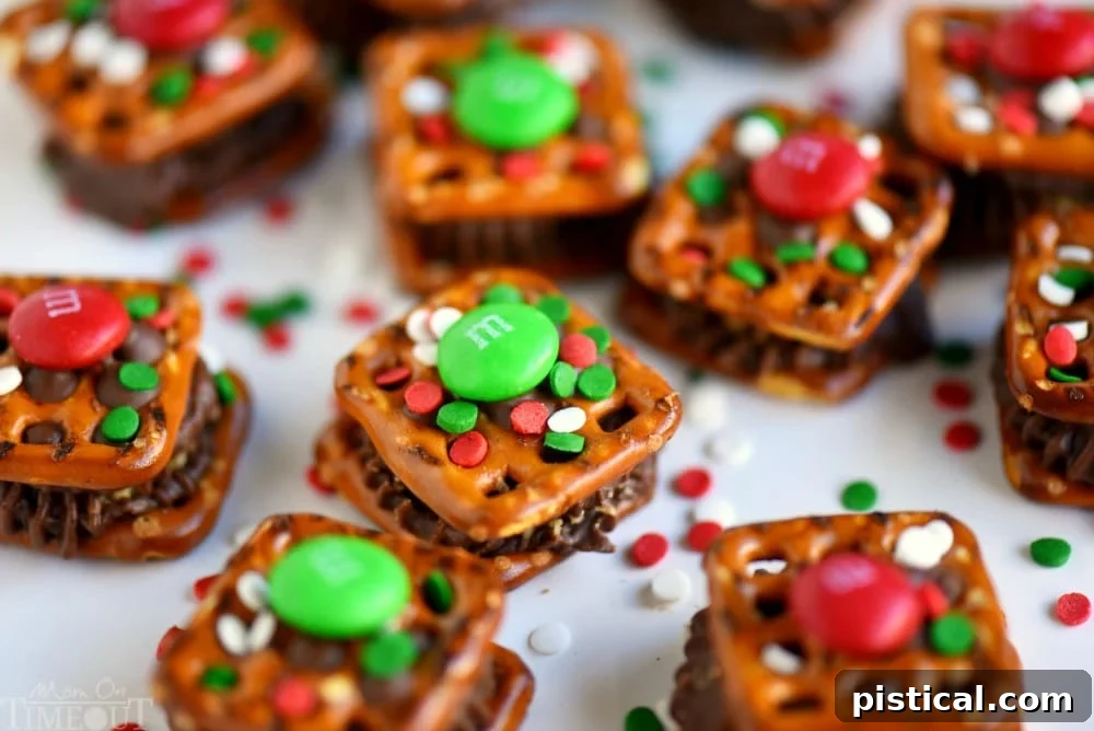Reese's Festive Sweet and Salty Pretzel Treasures 3 Close-up of a tray of freshly made Reese's Holiday Pretzel Bites with colorful M&M's and sprinkles.