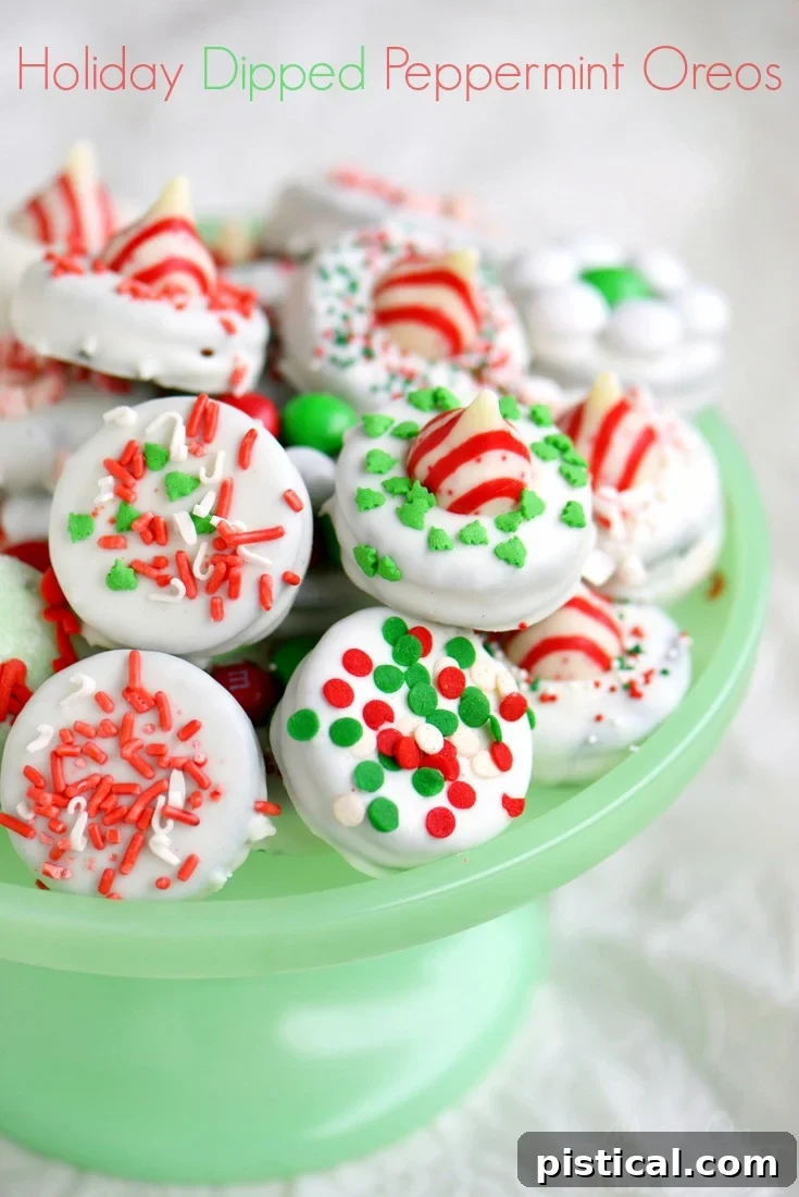 Elevate your Christmas gifting with these easy-to-make Holiday Dipped Oreos! Follow simple instructions and pro tips to create gourmet treats in no time. // Mom On Timeout #holidays #christmas #oreos #dippedoreos #candy #cookies #cookietray #dessert #easy A beautifully arranged platter of festive chocolate-dipped peppermint Oreos adorned with holiday sprinkles and candies, ready for gifting or serving.