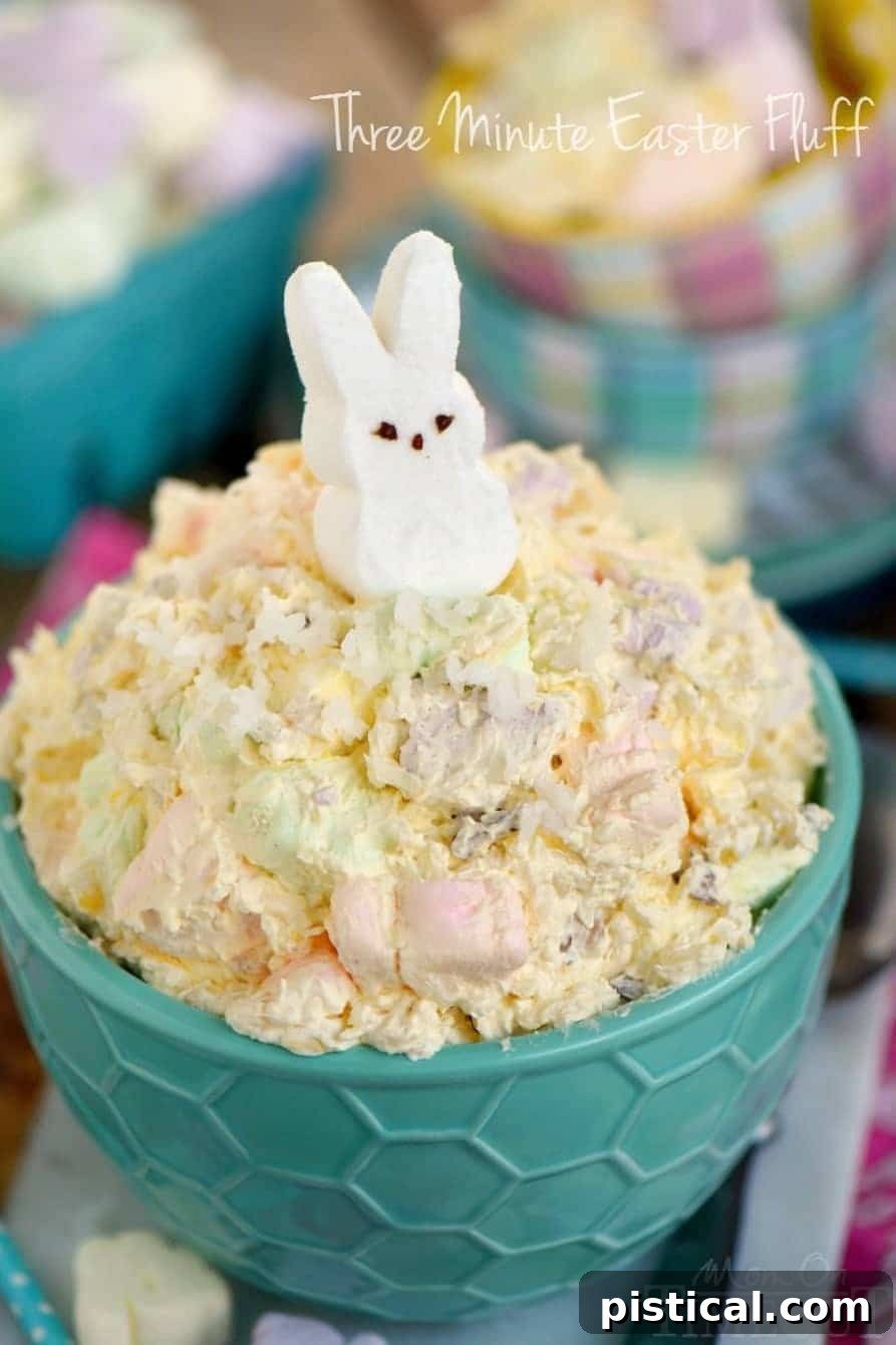 Quick Easter Whimsy 5 A fluffy dessert salad prepared for Easter, garnished with a classic white marshmallow peep, presented beautifully.