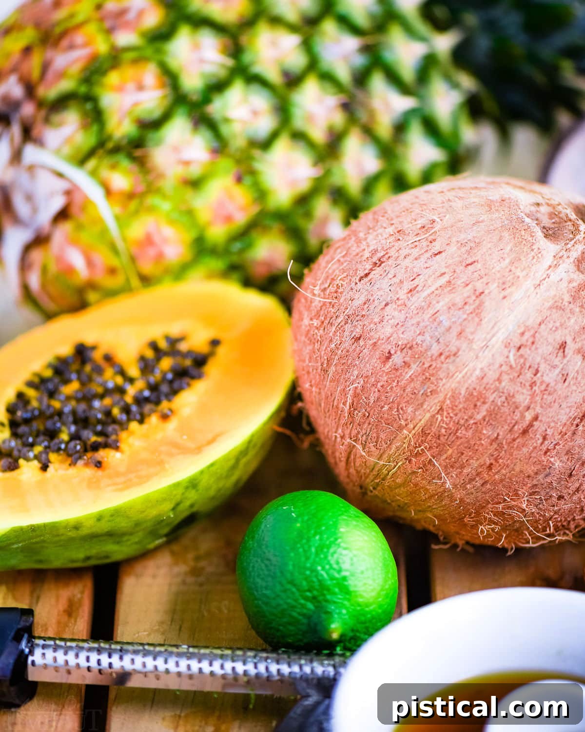 Island Fruit Medley with Zesty Honey Glaze 4 tropical fruit salad ingredients ready to be prepped for the salad.