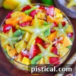 top down look at fruit salad with a star fruit right on top.
