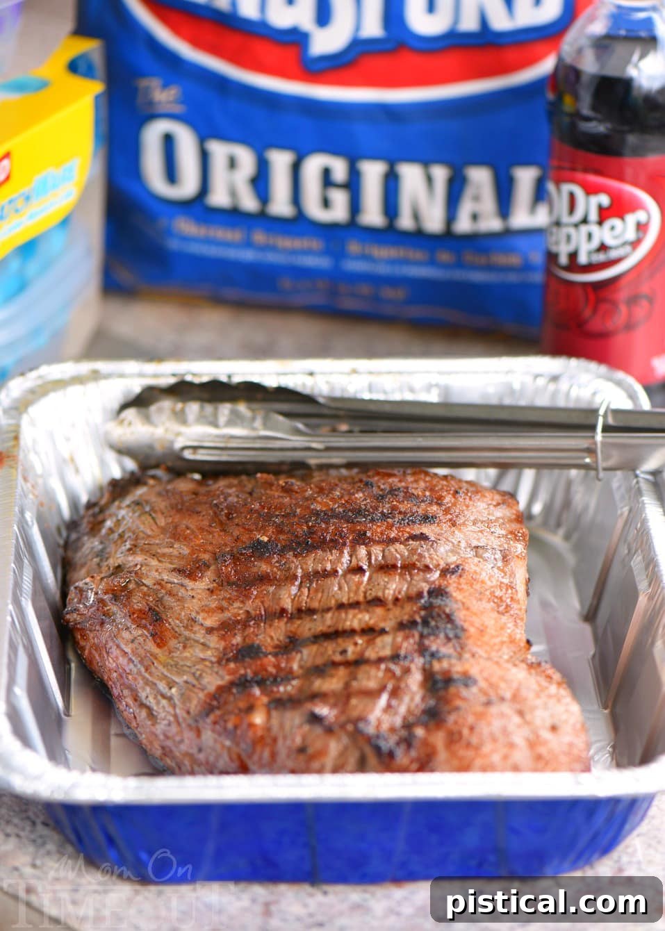Beef Brisket being seared on a grill, showing beautiful char marks and rich brown color