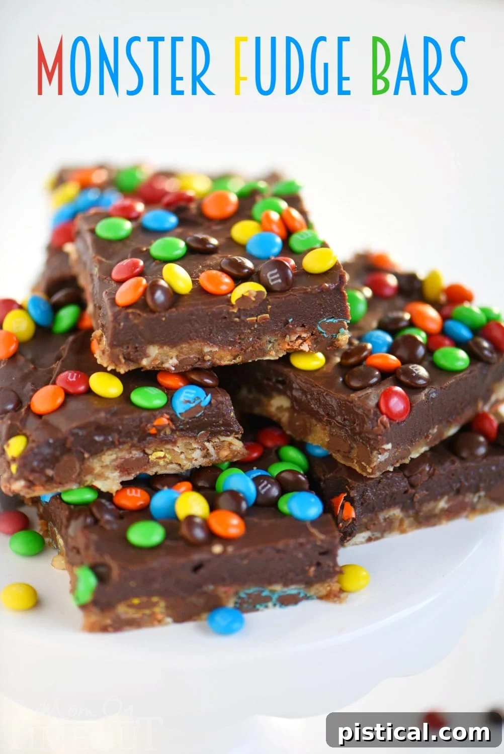 Irresistible Monster Fudge Bars: Oatmeal chocolate chip cookie bars topped with easy fudge and mini M&M's for a truly decadent treat!