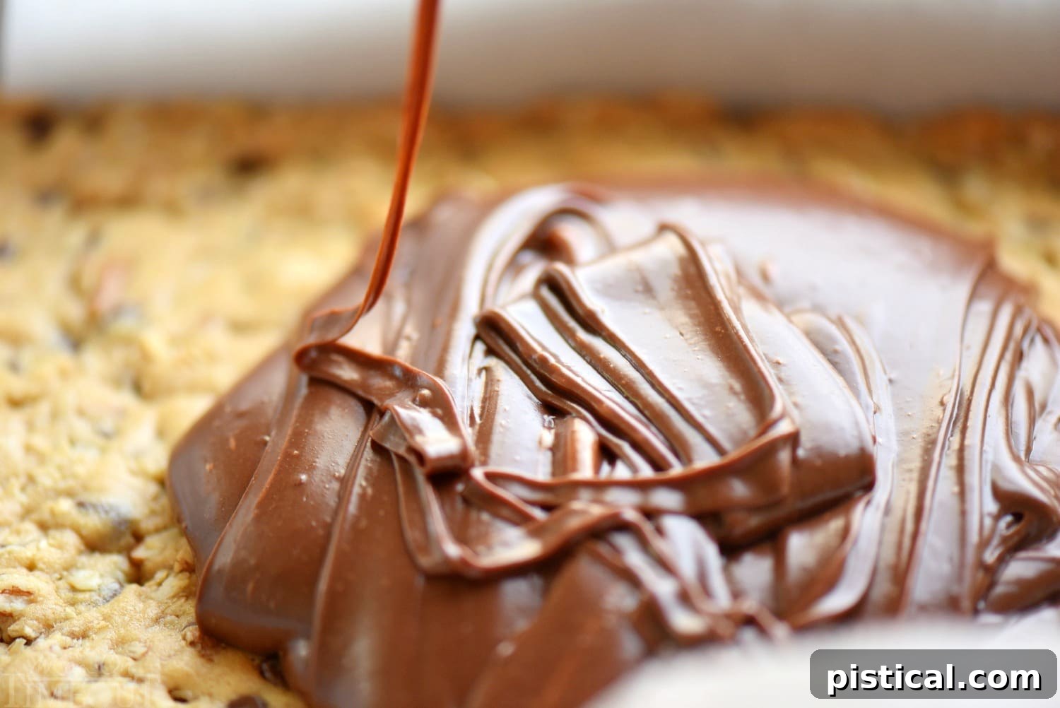 Ingredients for the fudge layer: sweetened condensed milk, chocolate chips, and vanilla extract.
