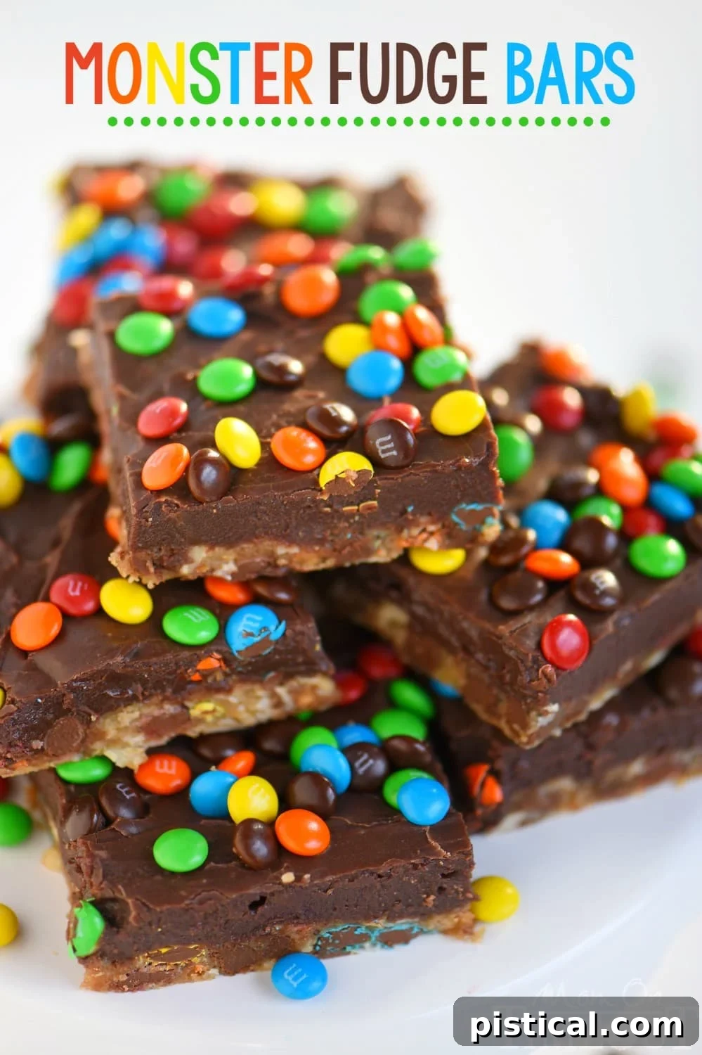 Stack of two Monster Fudge Bars, showing the thick fudge layer with M&M's and the oatmeal cookie base.