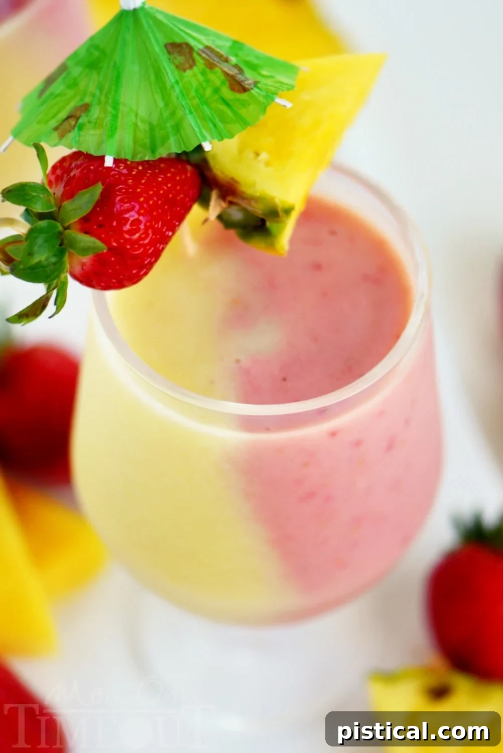 The Skinny Miami Vice Shake ready to be served in a tall glass with tropical garnishes.