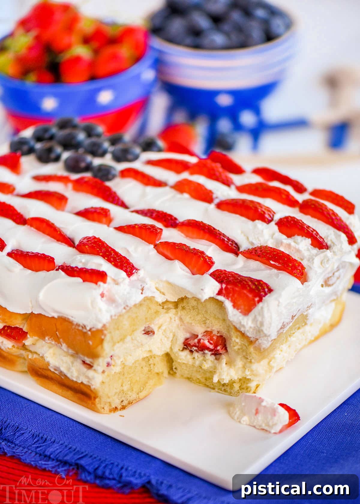 Effortless Berry Pull-Apart Cheesecake 2 Flag decorated Hawaiian roll dessert made with no bake cheesecake and fresh berries, ready to be pulled apart.