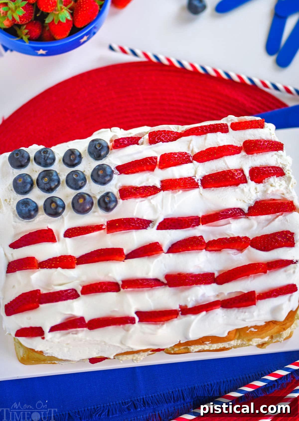 Effortless Berry Pull-Apart Cheesecake 3 Top-down view of a flag-decorated dessert for the 4th of July, made with Hawaiian rolls, fresh berries, and no-bake cheesecake filling.