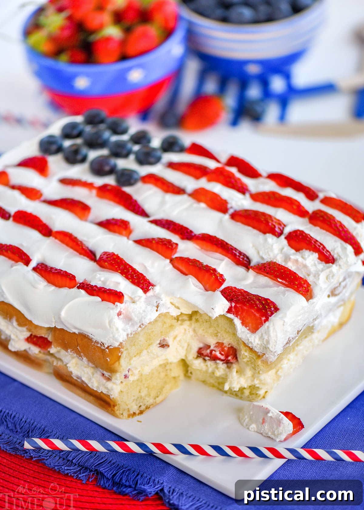 Effortless Berry Pull-Apart Cheesecake 5 Flag decorated Hawaiian roll dessert made with no bake cheesecake and fresh berries, ready for a gathering.