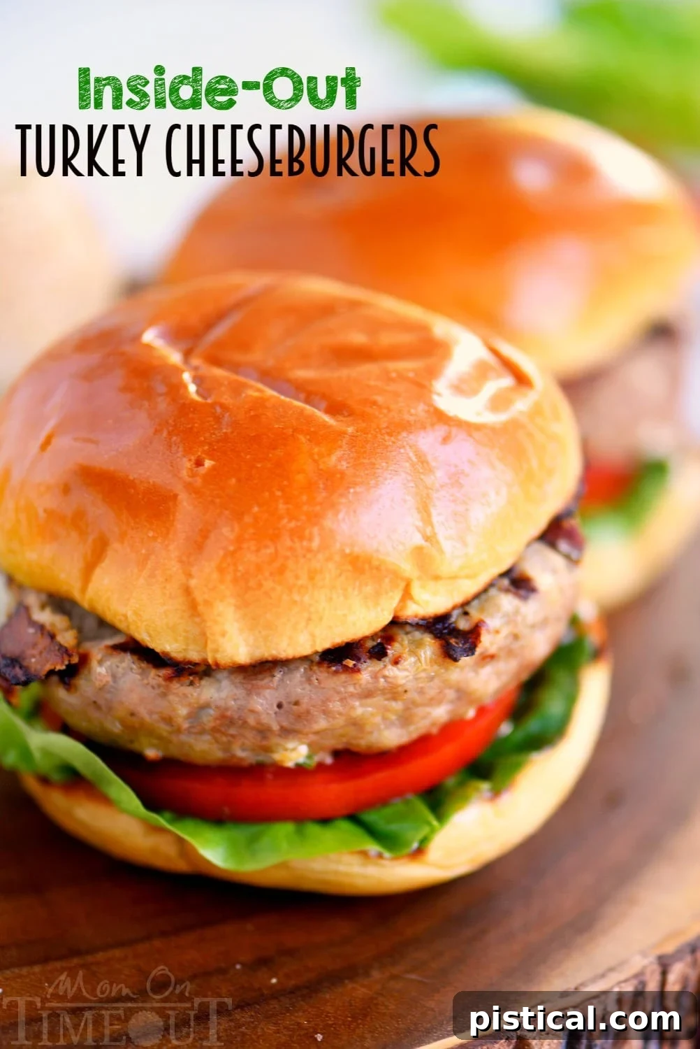 Juicy turkey burger cut in half showing melted mozzarella cheese and green onions inside