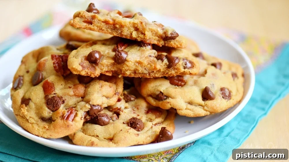Wide shot of Chocolate Chip Turtle Pudding Cookies on a cooling rack.