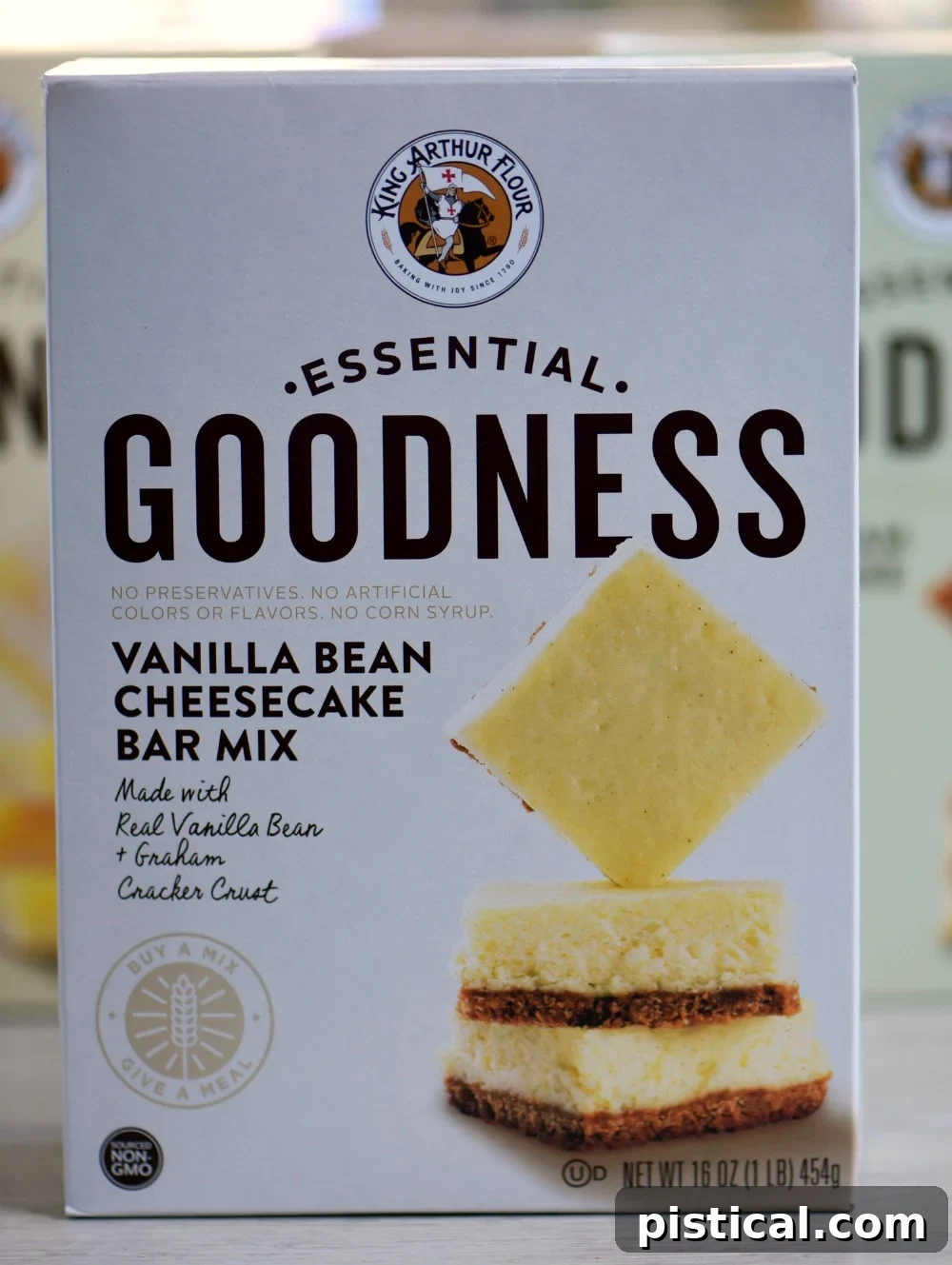Detailed view of the King Arthur Flour Vanilla Bean Cheesecake Bar Mix box, emphasizing its ease of use for creating delicious dessert bars with high-quality ingredients.