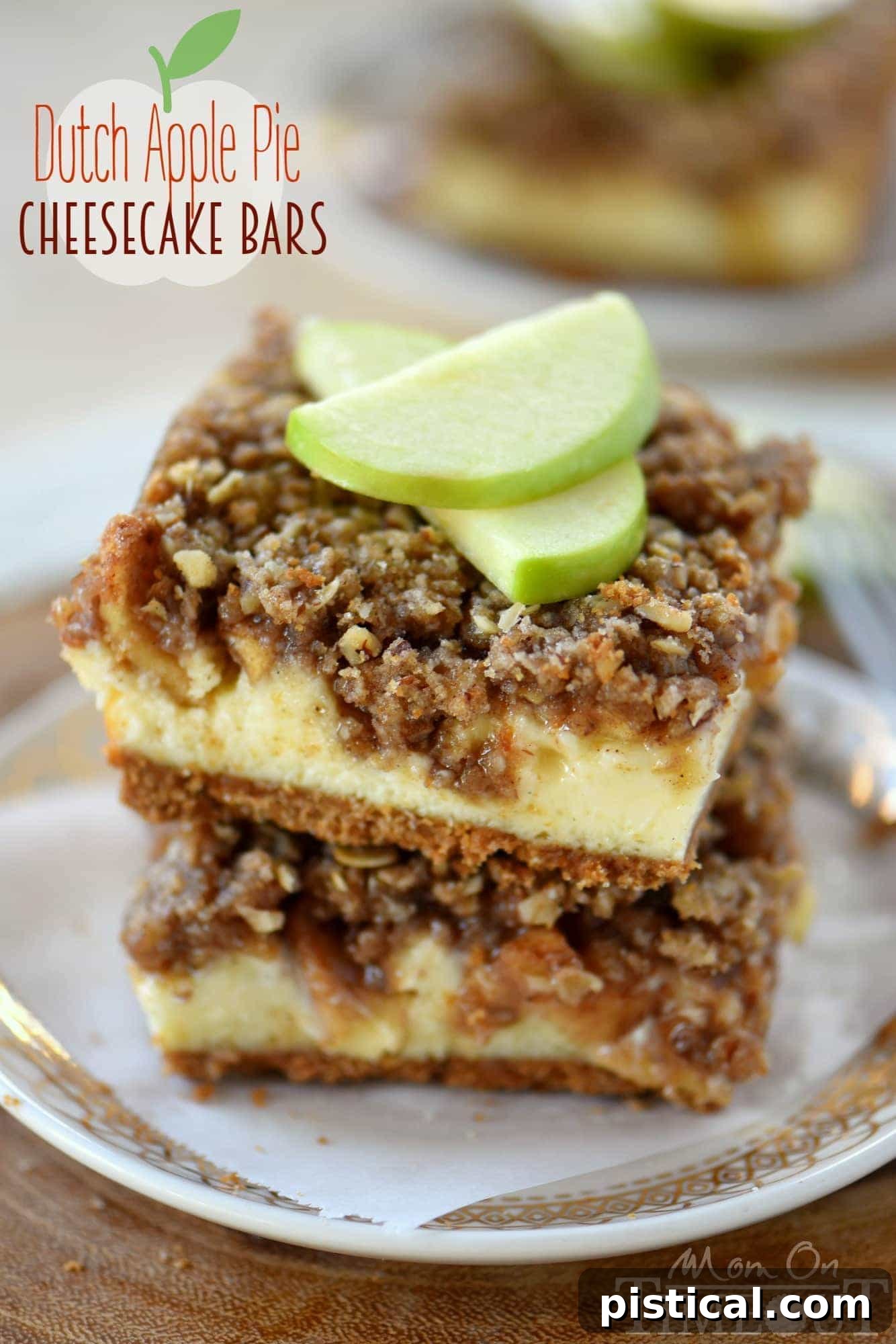Close-up of a slice of Dutch Apple Pie Cheesecake Bar, revealing the distinct layers of spiced graham cracker crust, creamy vanilla bean cheesecake, tender apple pie filling, and golden streusel topping, indicating rich texture and flavor.