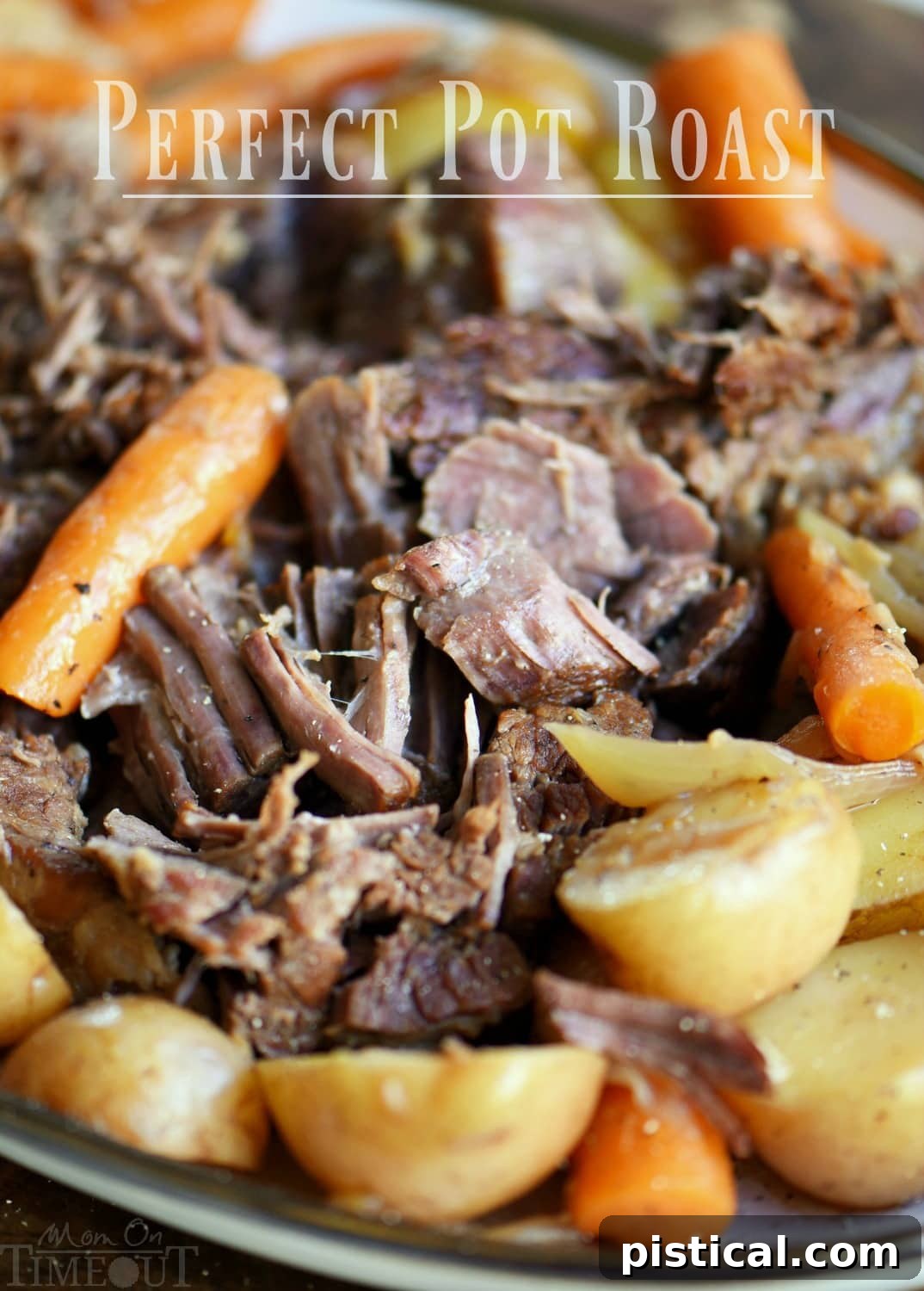 Perfect Pot Roast and Gravy pot roast beef shredded with veggies on platter