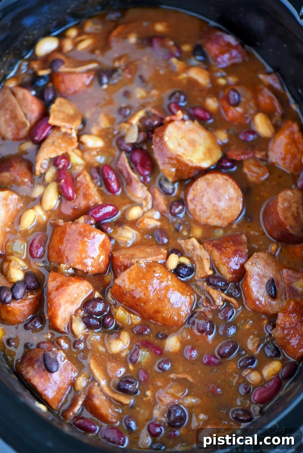 Finished Slow Cooker Kielbasa and Barbecue Beans in crockpot, perfectly cooked and ready to serve.