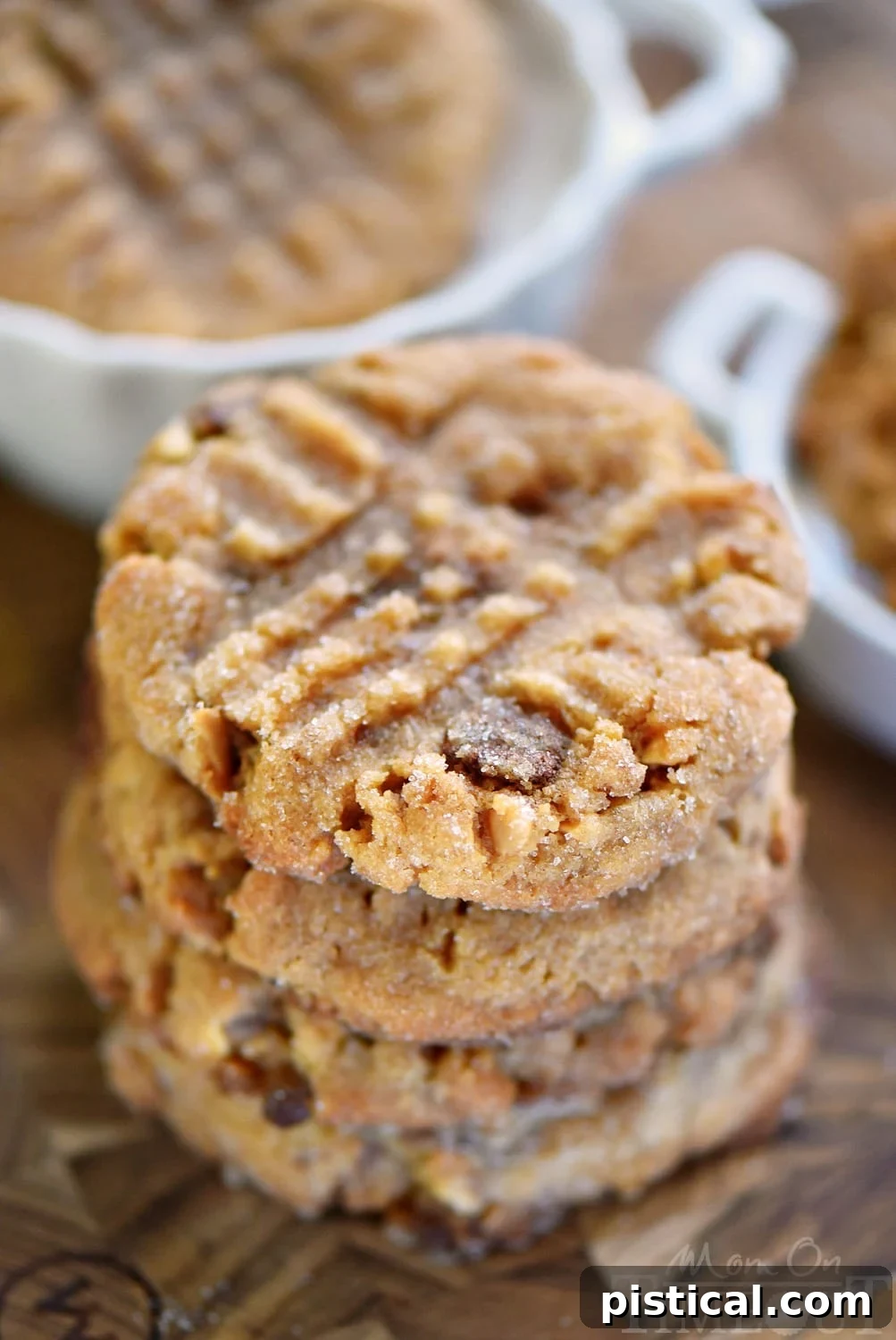 Sweet & Salty Flourless Toffee Peanut Butter Cookies 2 A plate of freshly baked flourless toffee peanut butter cookies, garnished with extra toffee bits, ready to be enjoyed.