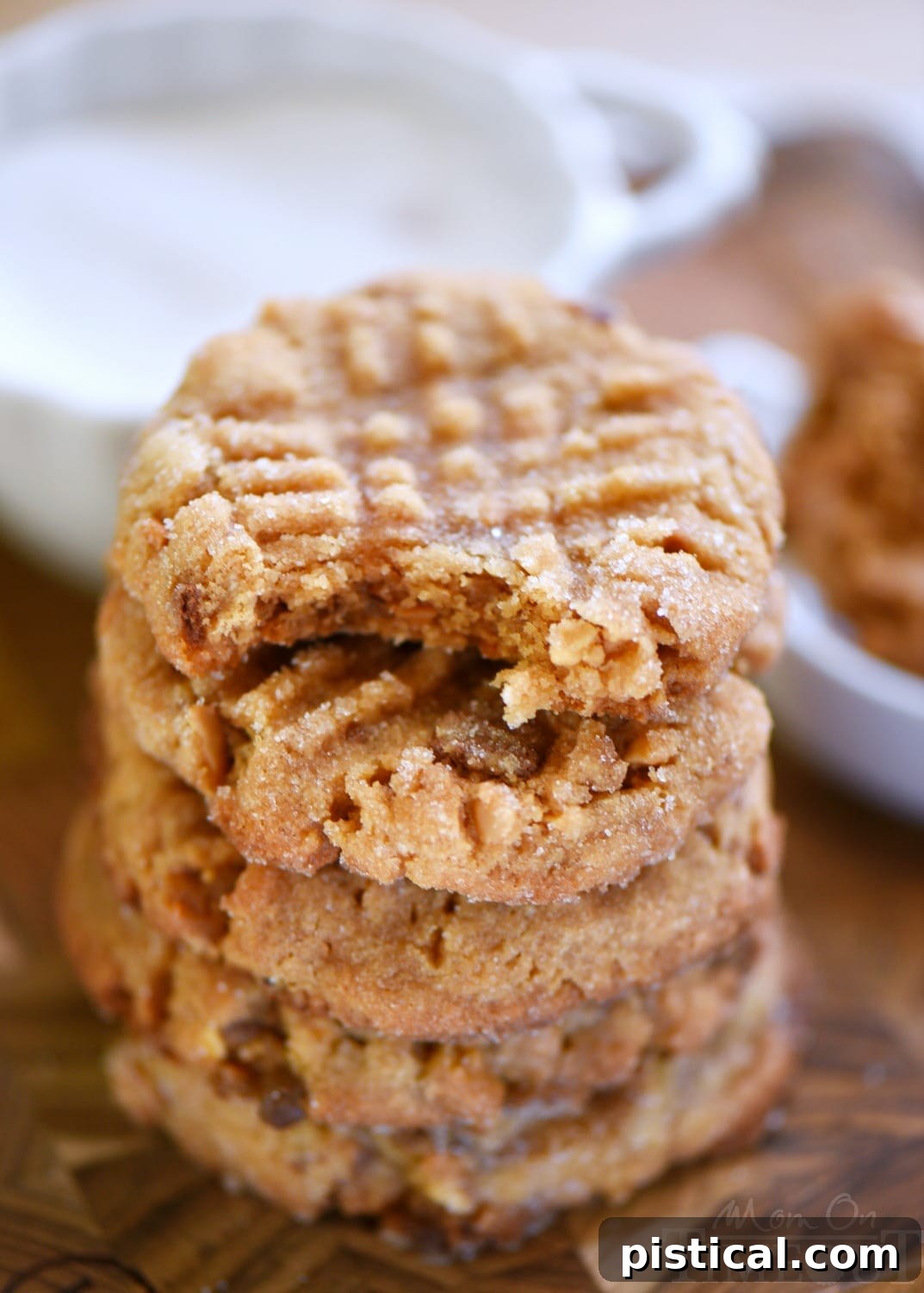 Sweet & Salty Flourless Toffee Peanut Butter Cookies 4 Close-up of unbaked flourless peanut butter cookie dough balls with traditional criss-cross fork marks, ready for the oven.