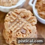 Sweet & Salty Flourless Toffee Peanut Butter Cookies 5 A single flourless toffee peanut butter cookie with a bite taken out, showing its chewy interior and toffee bits.