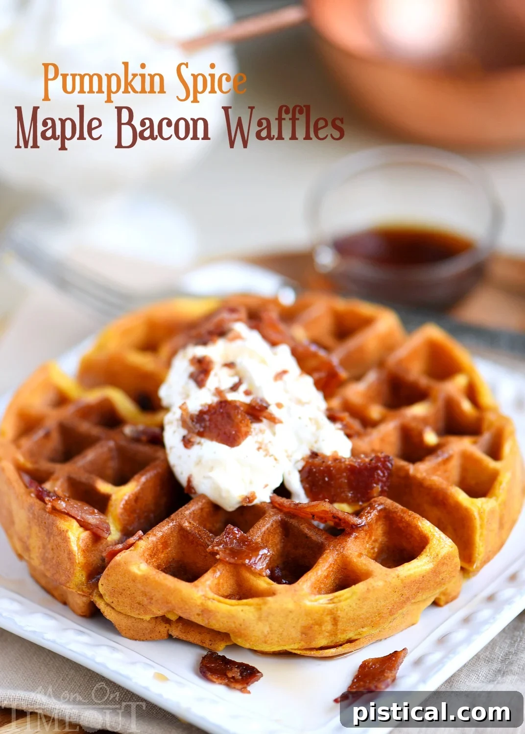 Stacked Pumpkin Spice Maple Bacon Waffles drizzled with maple syrup and topped with whipped cream and extra bacon bits, ready to be served.