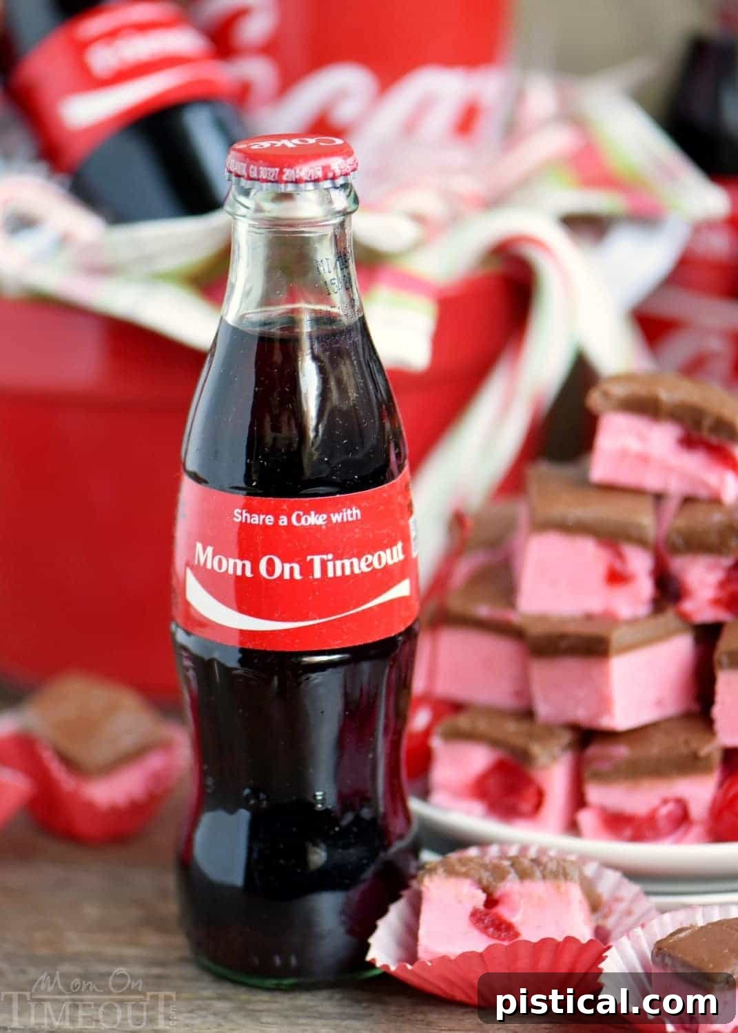 A close-up of a single square of Cherry Coke Fudge on a white napkin, highlighting the rich texture