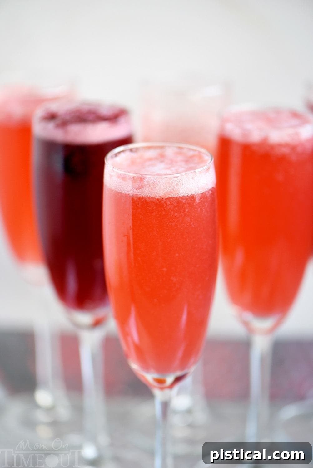 A festive glass of Berry Champagne Punch, garnished with fresh berries, ready for New Year's Eve, Easter brunch, or Mother's Day.