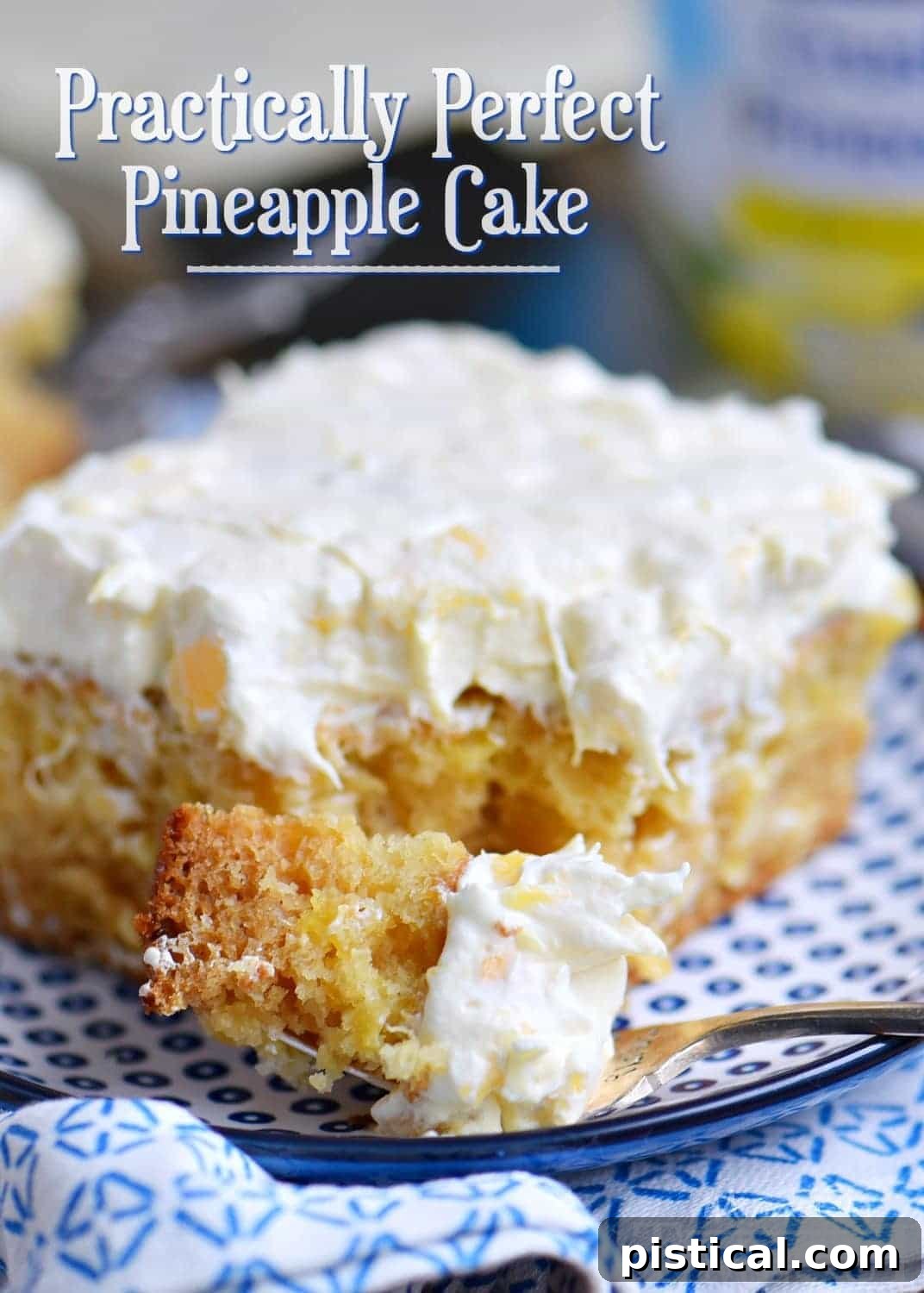A slice of moist pineapple cake with pineapple fluff frosting on a blue plate, perfect for dessert.