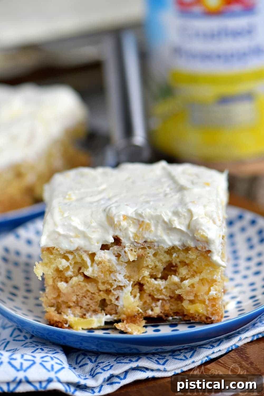 A close-up shot of the incredibly moist texture of the Practically Perfect Pineapple Cake, highlighting its soft crumb and golden color.