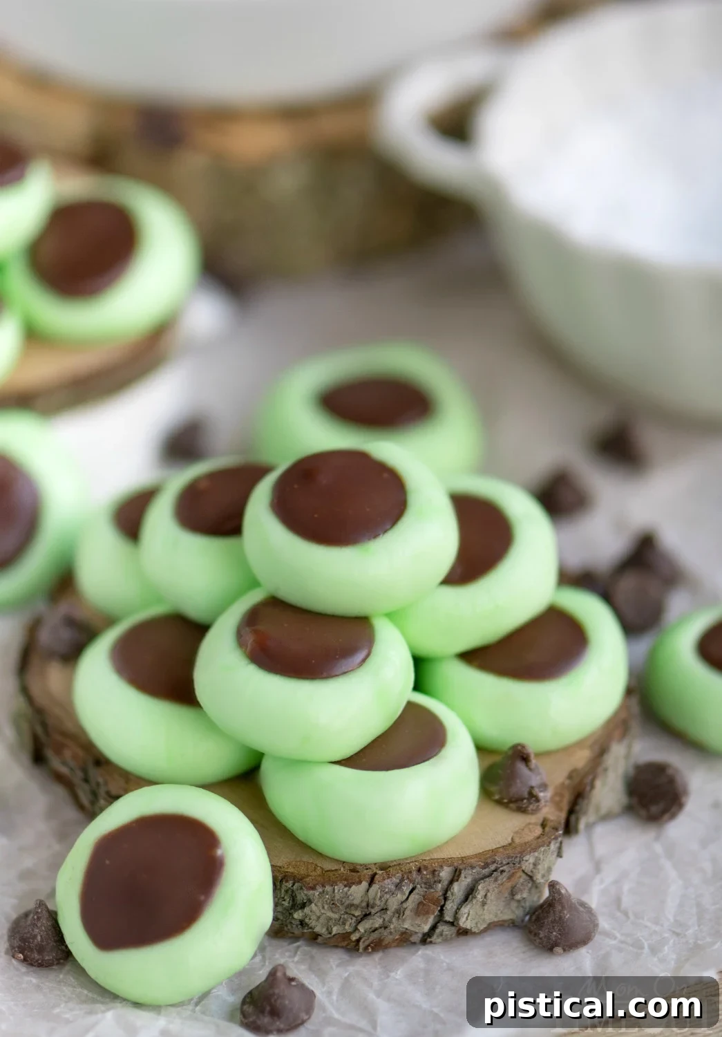 Close-up of Chocolate Mint Cream Cheese Buttons, showcasing the creamy green mint and dark chocolate ganache filling.