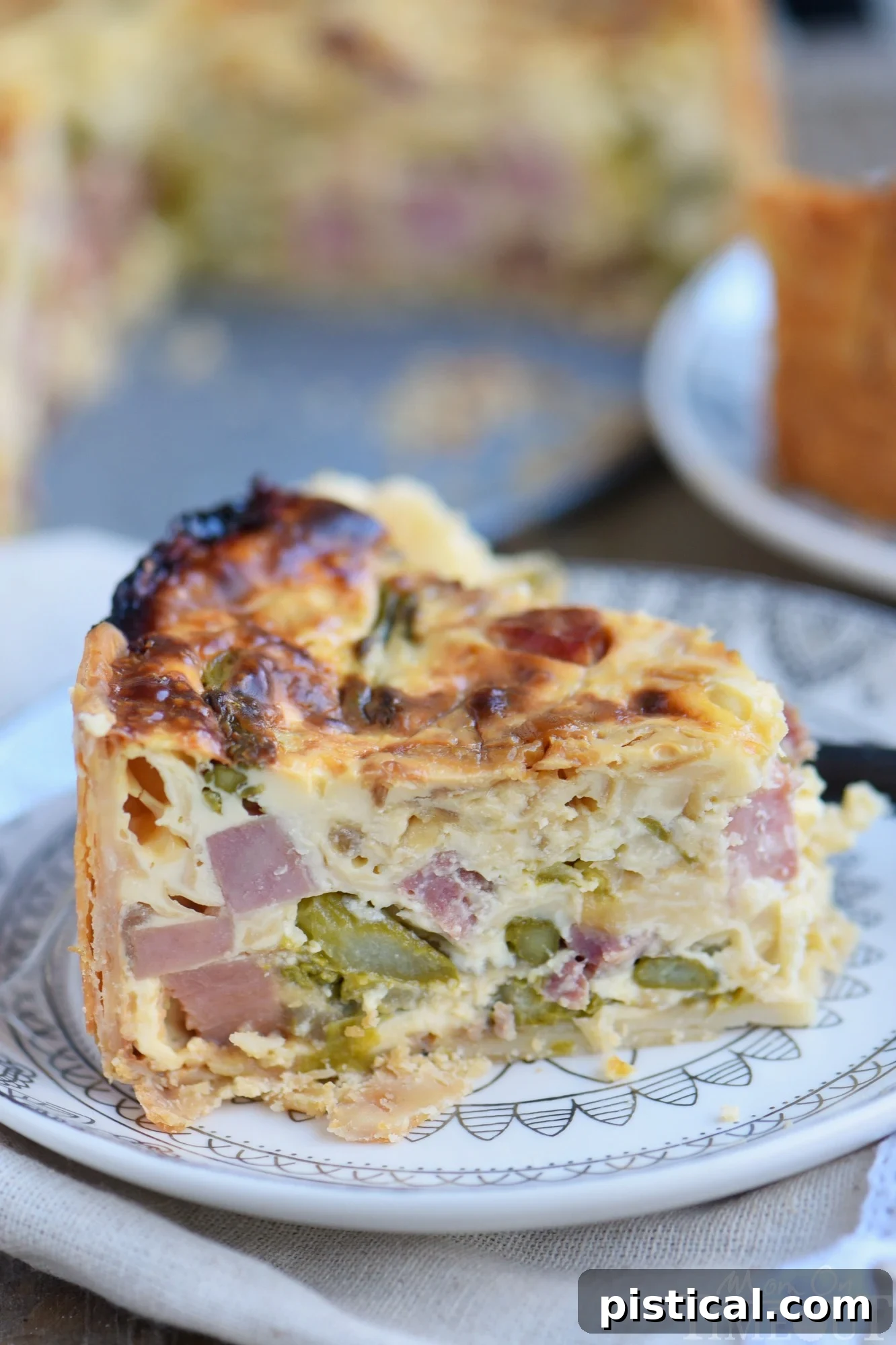 Sumptuous Deep Dish Ham and Asparagus Quiche 5 A close-up shot of the rich, golden Deep Dish Ham and Asparagus Quiche filling.