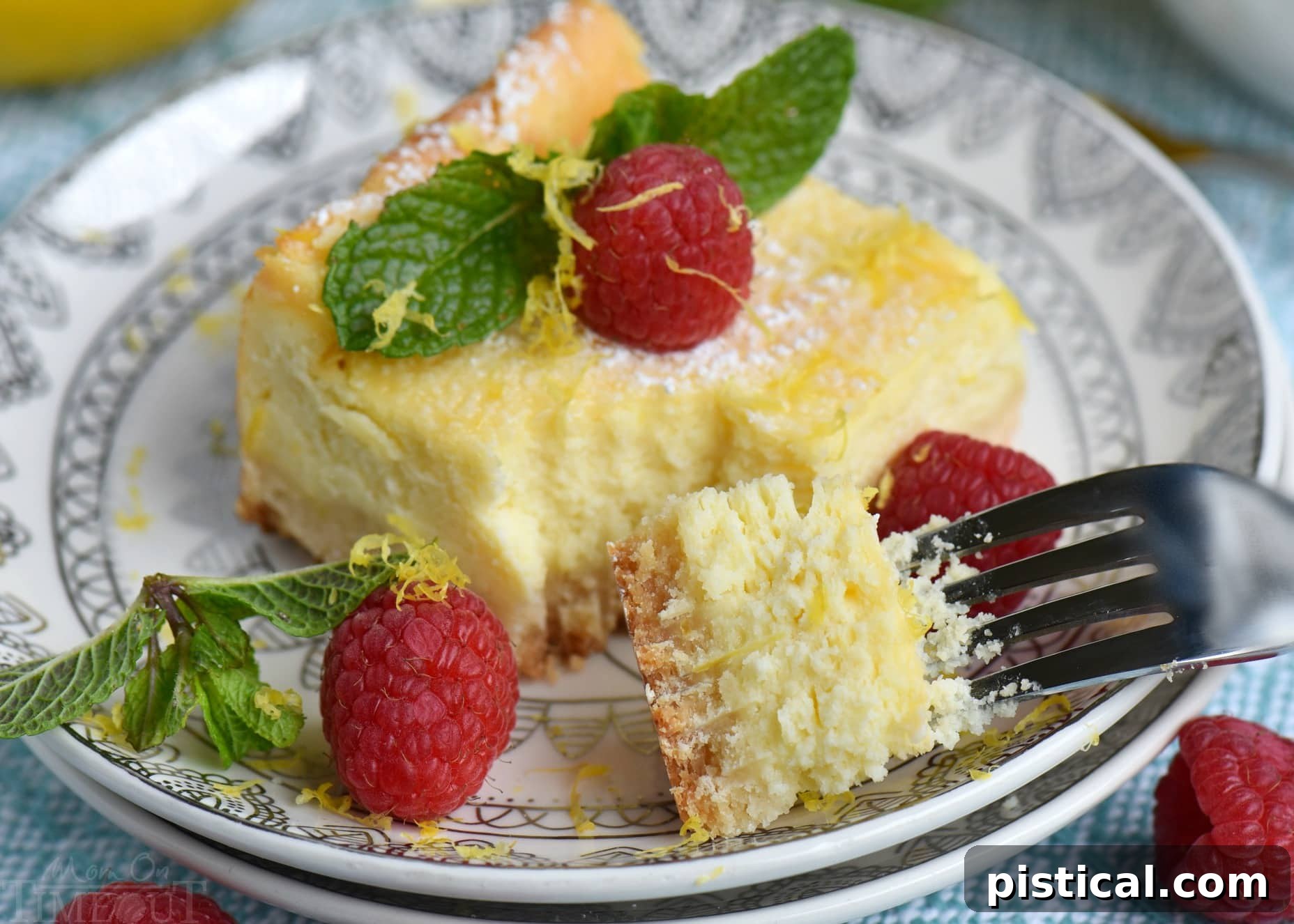 Close-up of a perfectly baked Lemon Cheesecake Bar, showcasing the creamy filling and golden crust.