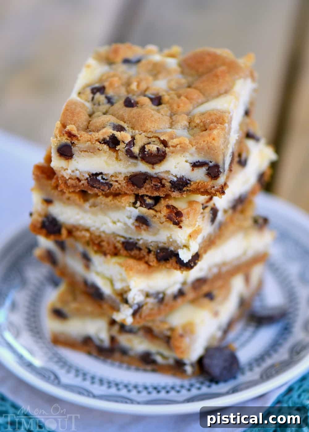 Overhead shot of freshly baked Chocolate Chip Cookie Cheesecake Bars in a baking dish before slicing.