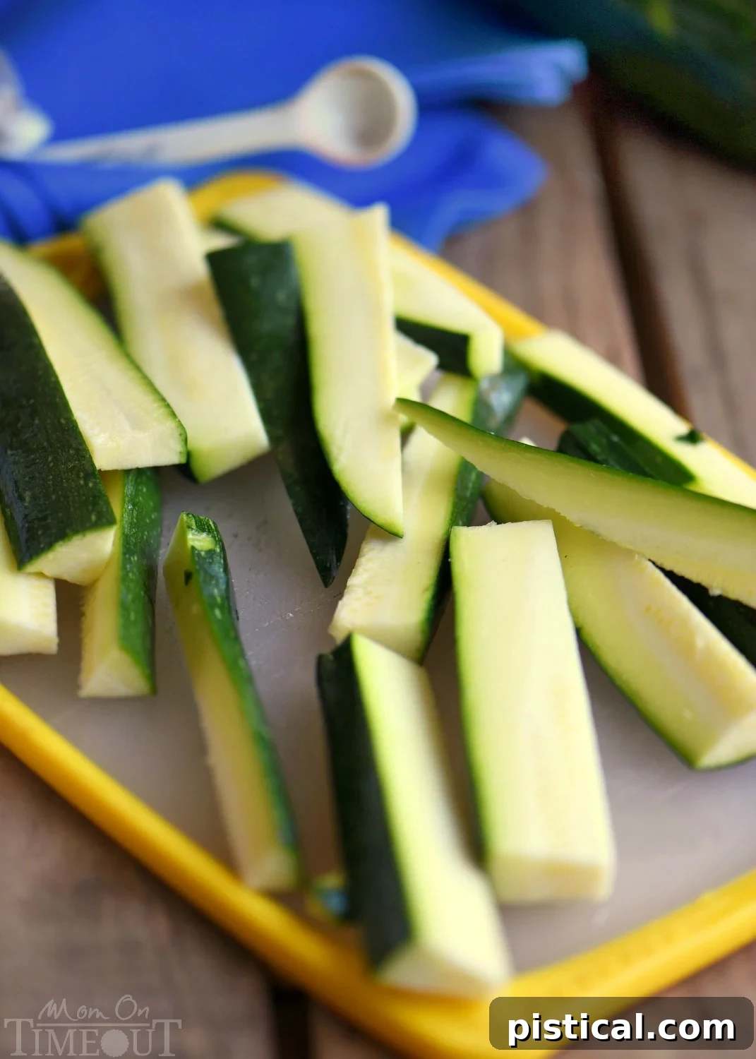 Golden brown zucchini fries seasoned with Parmesan, paprika, and garlic powder. A healthy and delicious snack or side.