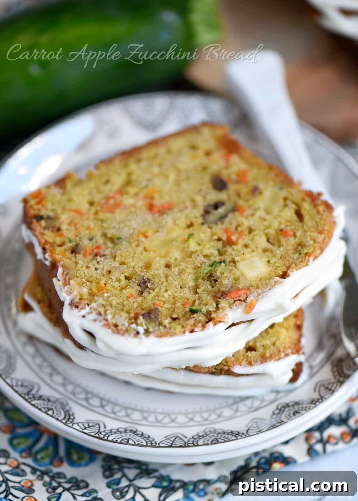 Spiced Carrot Apple Zucchini Loaf 2 Moist Carrot Apple Zucchini Bread, sliced to reveal vibrant ingredients