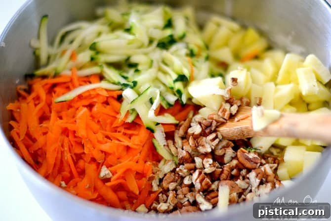 Spiced Carrot Apple Zucchini Loaf 4 Bowl of fresh shredded carrots, zucchini, diced apples, and chopped pecans
