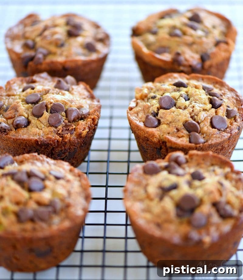 Ultimate Jumbo Banana Muffins with Gooey Chocolate and Sticky Toffee 3 Close-up of a stack of moist Jumbo Chocolate Chip Toffee Banana Muffins, showing their rich texture and delicious add-ins. Ideal for a sweet breakfast or snack.