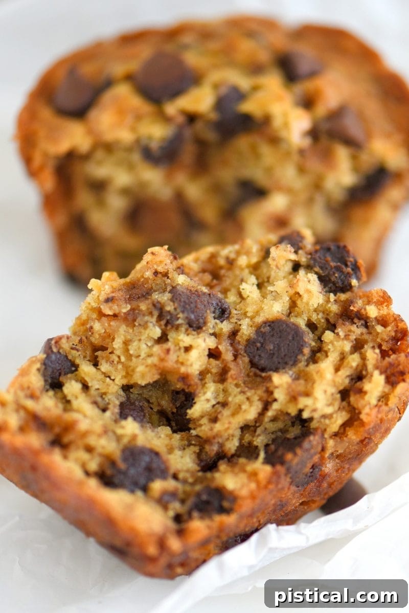 Ultimate Jumbo Banana Muffins with Gooey Chocolate and Sticky Toffee 4 A single Jumbo Chocolate Chip Toffee Banana Muffin, showcasing its golden-brown top and delightful texture, ready to be enjoyed.