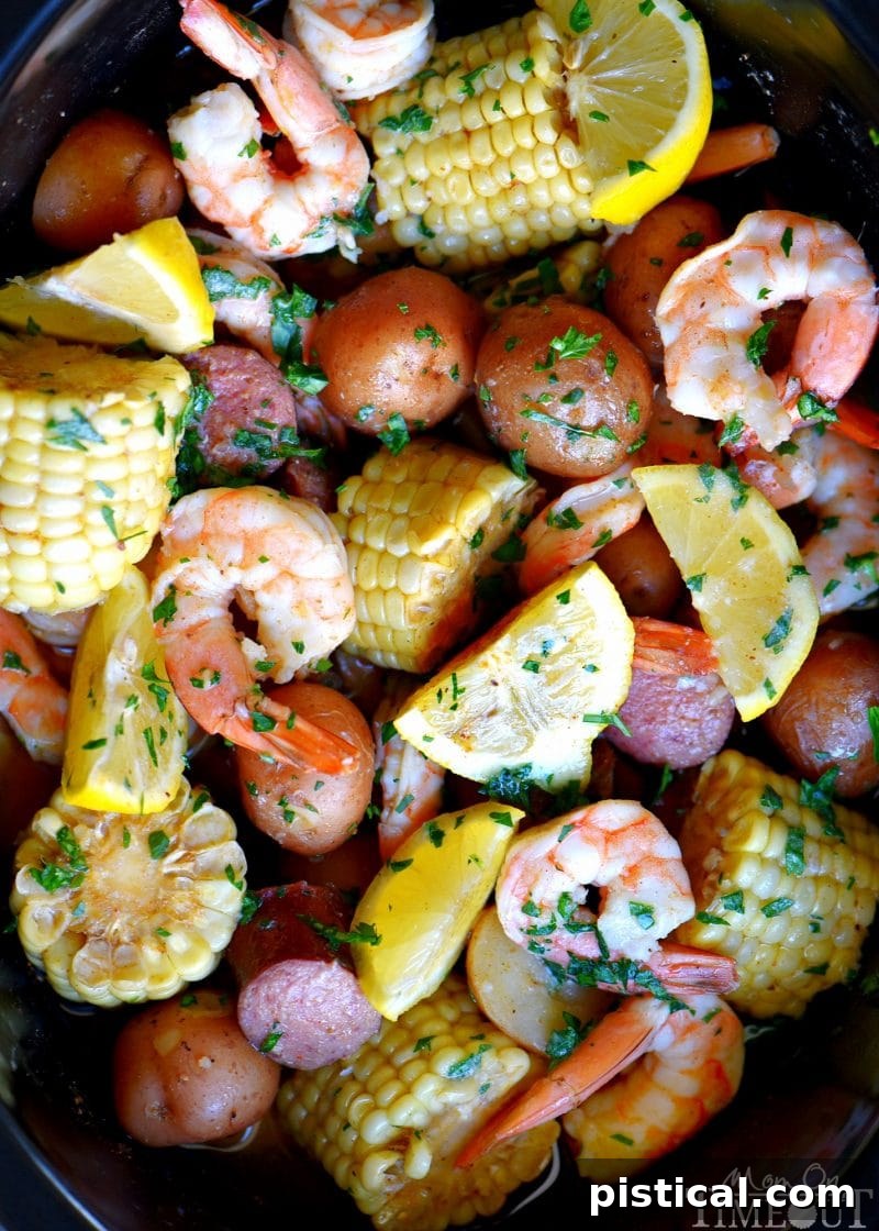 Slow cooker shrimp boil recipe in crockpot with potatoes, sausage, and corn
