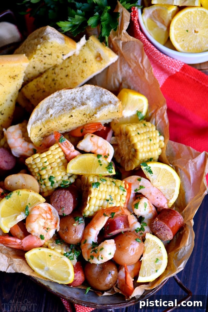 Old Bay shrimp boil served in a basket with lemon wedges and garlic bread