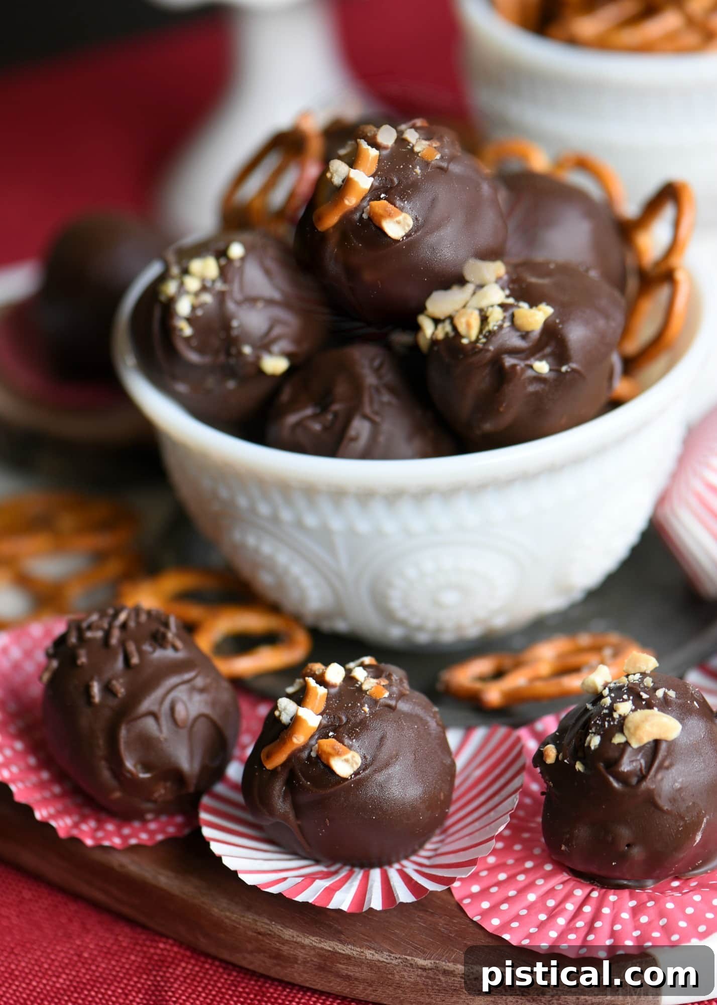 Handmade Peanut Butter Pretzel Truffles on a baking sheet, ready for holiday gifting or serving. These creamy, chocolate-covered treats have a delightful sweet and salty crunch.